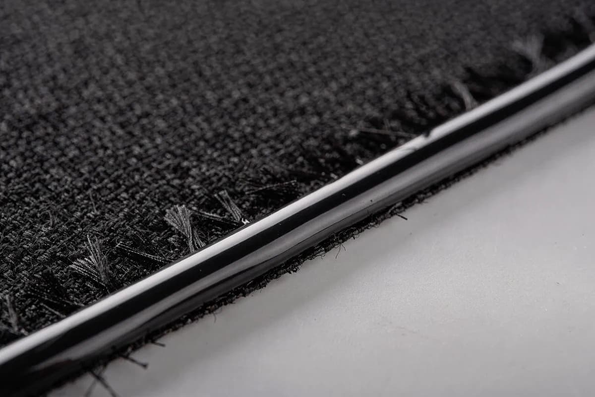 Close-up of a sealed cut edge on synthetic polyester fabric