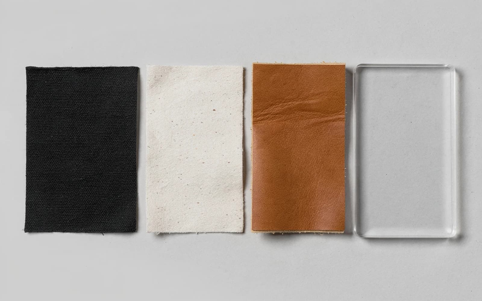 Swatches of polyester, cotton, leather and clear acrylic with cut edges