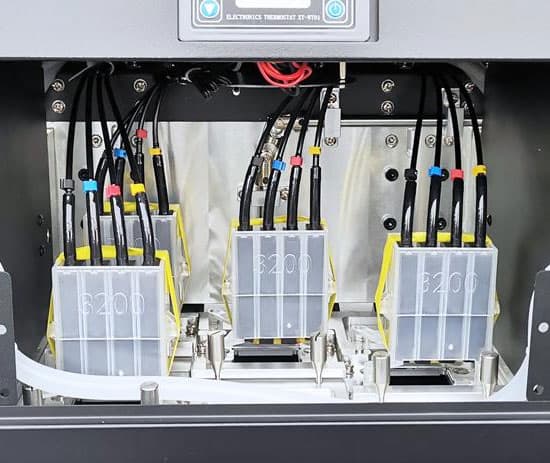 Three I3200 heads mounted in the Otus carriage, inked and plumbed