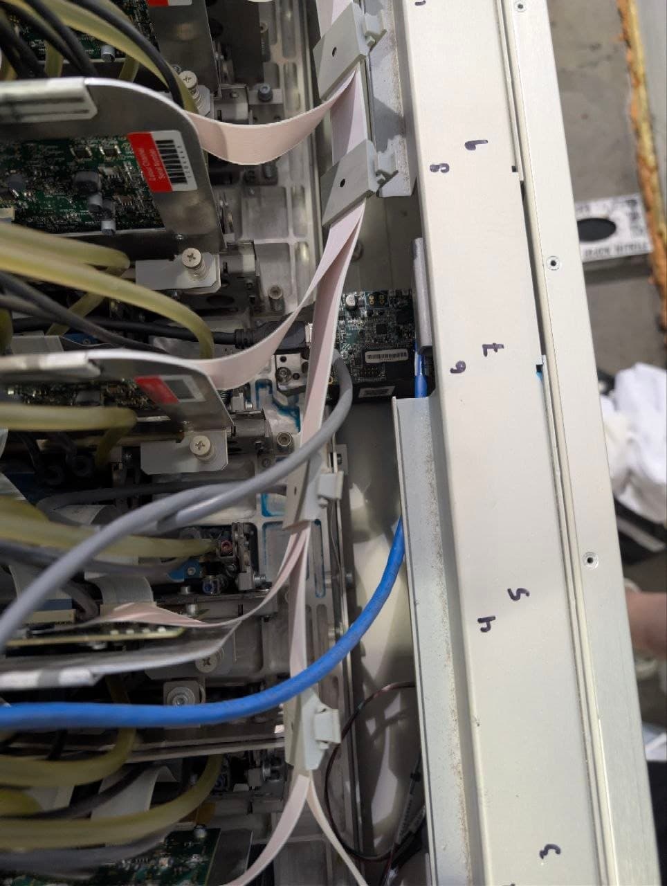 Printhead control boards and ribbon cables inside the open carriage of an Océ Arizona 2280