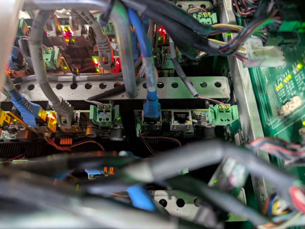 Printhead control boards in place in the carriage, status LEDs lit red and green