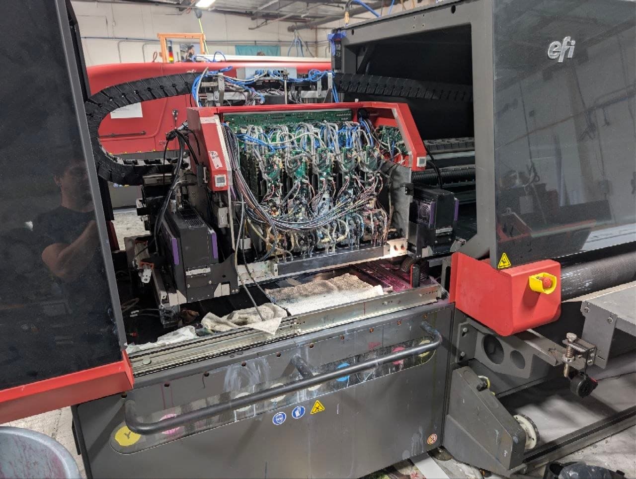 Open carriage of an EFI VUTEk H5 with the printhead wiring loom exposed